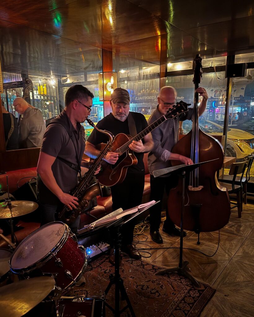 A photo of the jazz quintet playing live at the Charlatan
